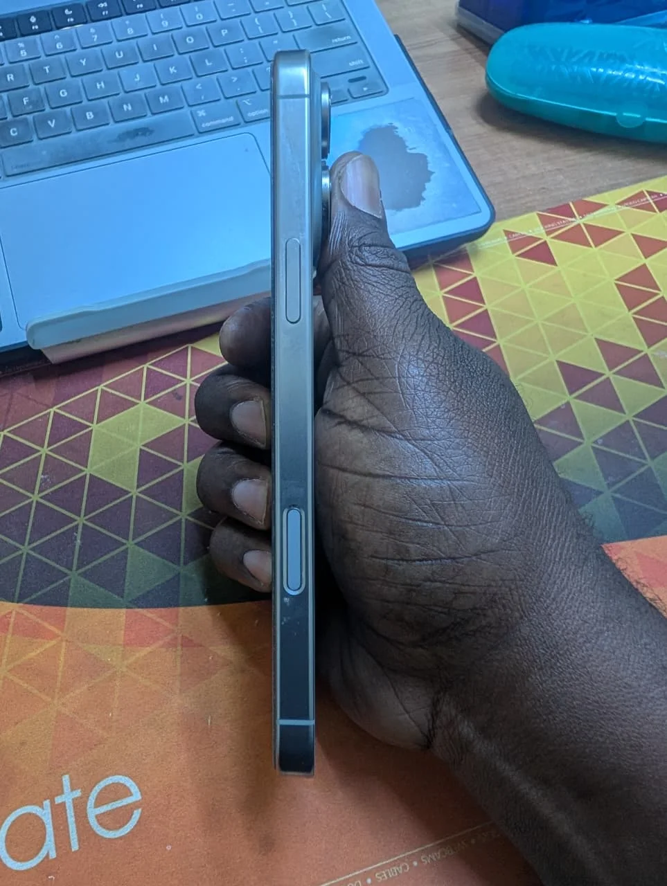 Side profile of iPhone 16 Pro Max 256GB showing frame and buttons