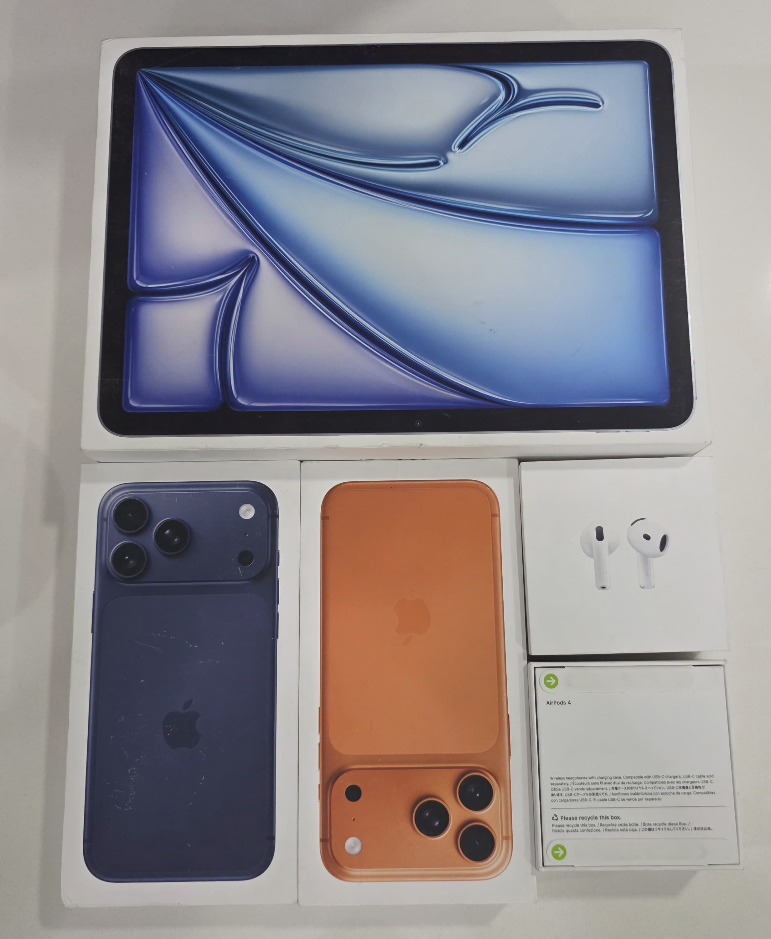 Apple device bundle photo with iPhone, iPad and AirPods at The Source Arena JA.