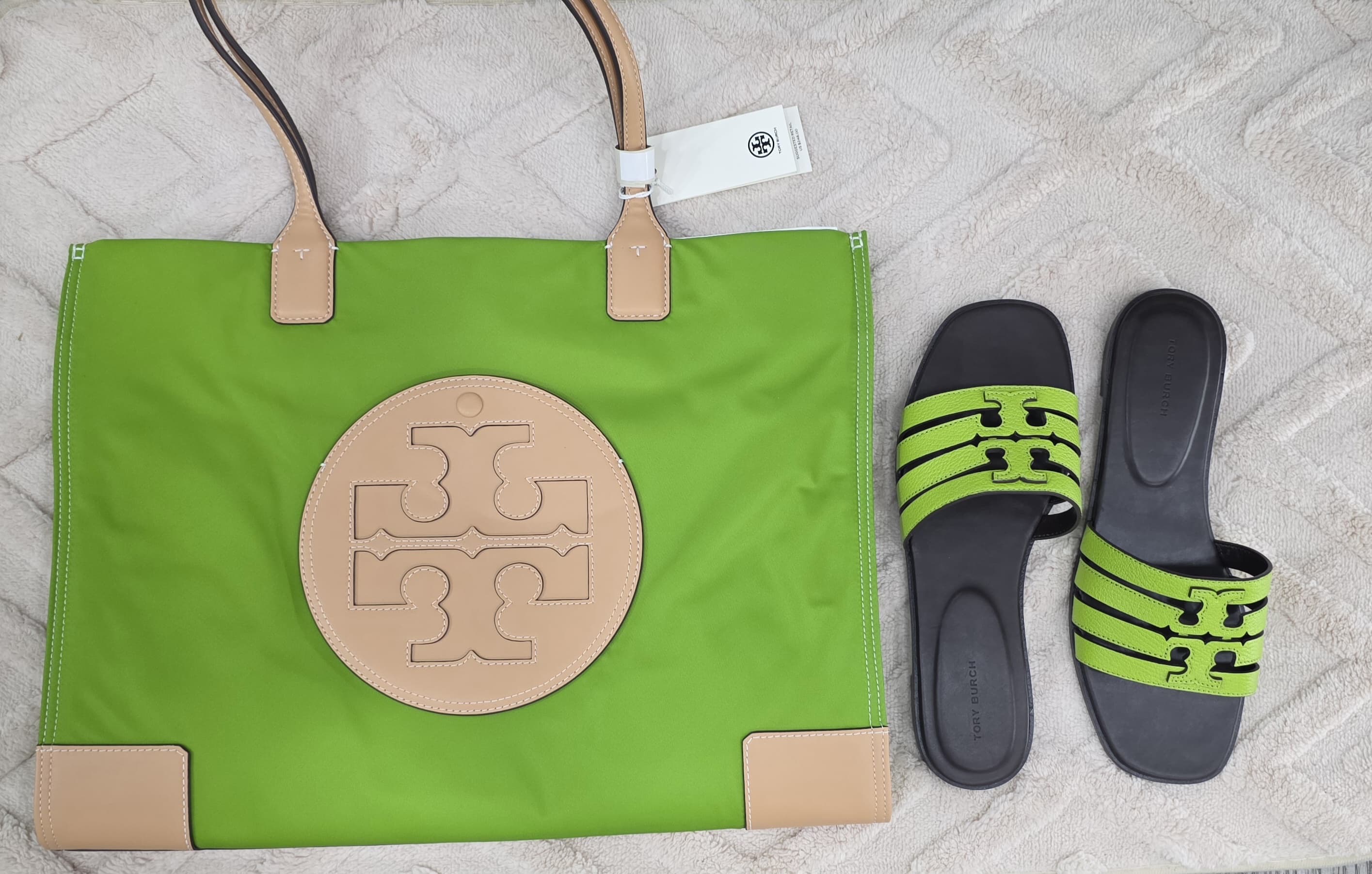 Tory Burch green handbag and slippers photo at The Source Arena JA.